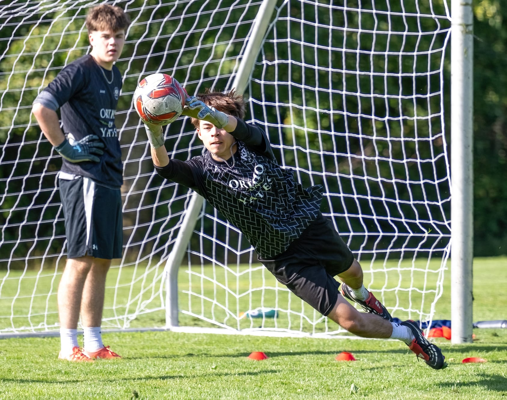 KD Elite goalkeeper making a diving save at the Finishing & Goalkeeping Clinic