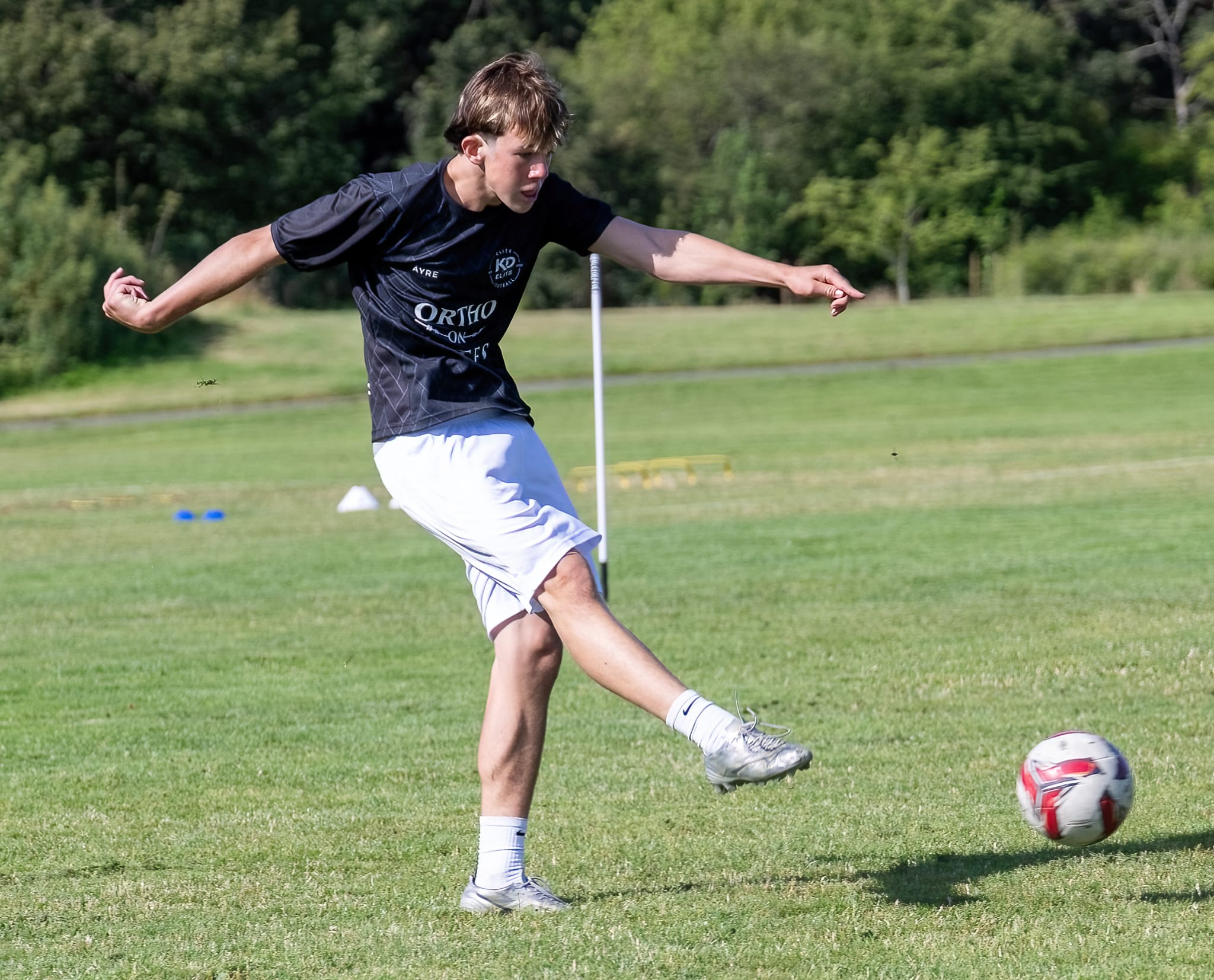 KD Elite attacking player striking the ball at the Finishing & Goalkeeping Clinic